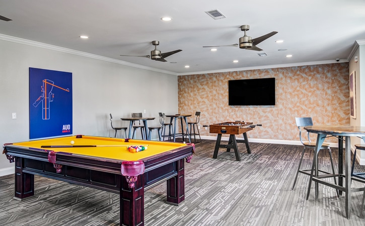 the collective at auburn luxury off campus cottage apartments near auburn university resident clubhouse game room with billiards and foosball tables